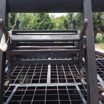 a wooden bench sitting on top of a table