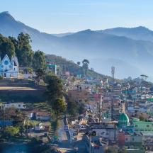 a view of a city with mountains in the background