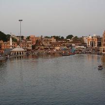 a boat in a river in a city with buildings