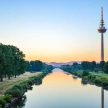a river with a tv tower in the background