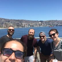 a group of people posing for a picture on a boat
