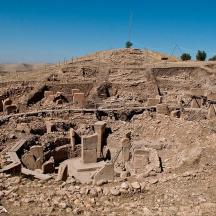 an ancient building on top of a hill