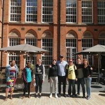 a group of people standing in front of a building