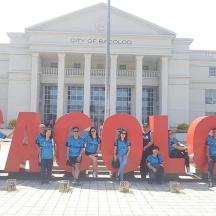 a group of people posing in front of the city of santiago