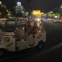 a group of people riding a ride in a food truck