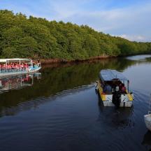 a group of people on a boat in a river
