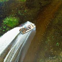 a boat traveling down a river in a body of water