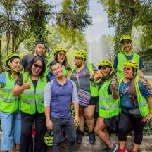 a group of people in hard hats posing for a picture