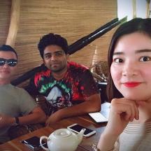 a group of three people sitting at a table