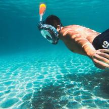 a man in the water with a paddle