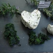 a group of rocks and greens on a table with a flag