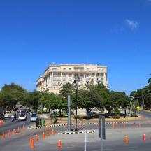 a street with orange cones in front of a building