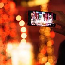 a person taking a picture with a cell phone