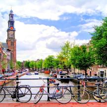 a group of bikes parked next to a river