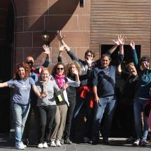 a group of people with their hands in the air