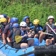 a group of people are rafting on a river