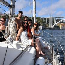 a group of people sitting on a boat in the water