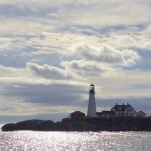 a lighthouse on a small island in the water