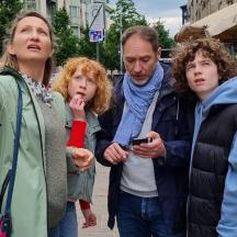 a group of people standing on a street
