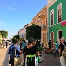 a group of people walking down a street