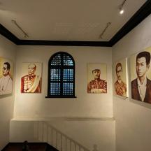 a room with portraits offamousfamous actors on the wall