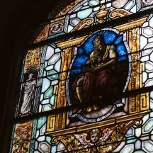a stained glass window with aievalievalieval