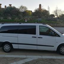a white van parked in a parking lot