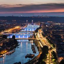 a view of a river with a city at night