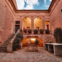 an old brick building with stairs and a stair case