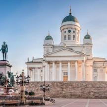 a large building with a statue in front of it