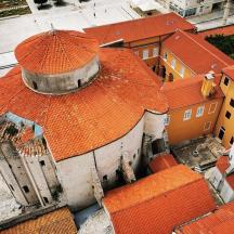 an overhead view of a building with orange roofs