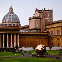 a large building with a statue in front of it
