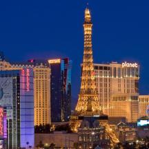 a city skyline with the eiffel tower at night