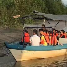 a group of people on a boat in the water