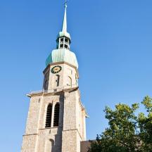 a tall tower with a clock on the top of it