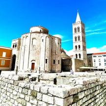 an old building with a tower and a church