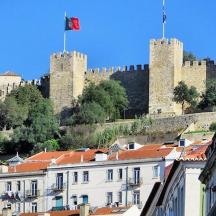 a city with a castle in the background