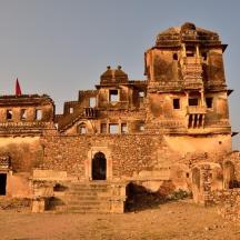 an old building in the middle of a field