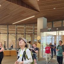 a group of people walking around in a building