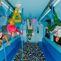 a group of people doing tricks on a train