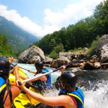 a group of people on a raft in a river