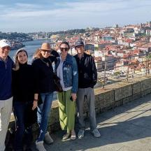 a group of people posing for a picture on a wall