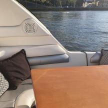 a table on the back of a boat on the water
