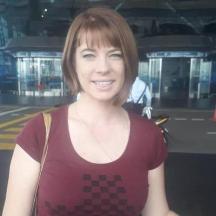 a woman is posing for a picture in a building