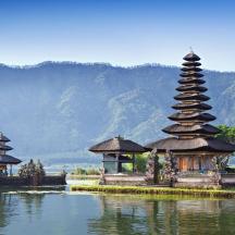 a group of temples in the middle of a body of water