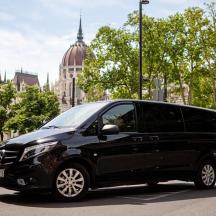 a black van parked in front of a building