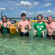 a group of people standing in the water
