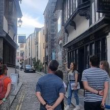 a group of people walking down a street