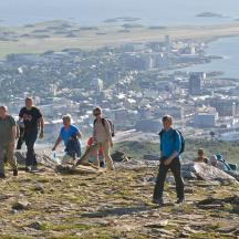 a group of people standing on top of a hill