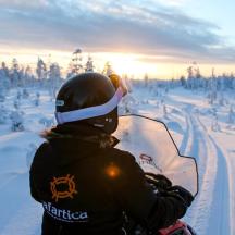 a person is holding a snowboard in the snow